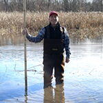 David Padulo measuring water depth